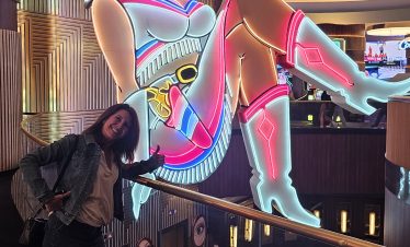 Colorful neon art of a cowgirl in a cowboy hat at Fremont Street, Las Vegas.