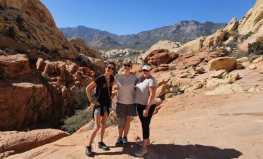 Hiking in Red Rock Canyon with scenic desert views and mountain landscapes.
