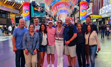 Group of tourists enjoying Fremont Street light show in Las Vegas.
