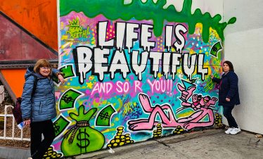 Colorful graffiti mural in Las Vegas Downtown Fremont Street with positive message.