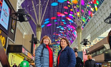 Vibrant Fremont Street lights and colorful balloons in Las Vegas downtown.