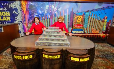 Fremont Street experience with two women enjoying the vibrant nightlife and iconic neon signs in dow.