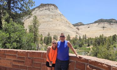Couple enjoying Zion National Park views during a hiking adventure.