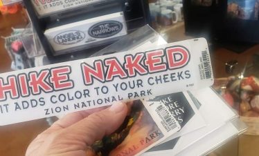 Hike Naked sign promoting outdoor adventure at Zion National Park.
