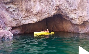 Person kayaking in a cave at Black Canyon near Hoover Dam.