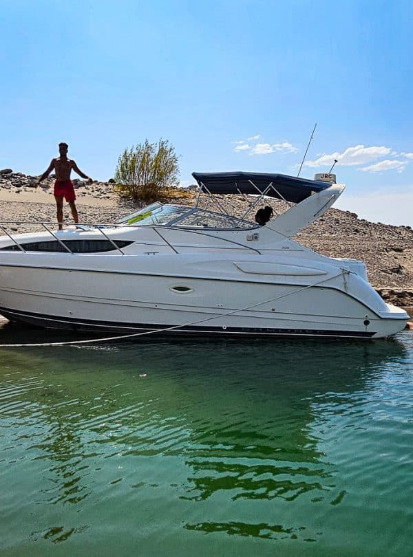 Private boat on Lake Mead with scenic desert background.